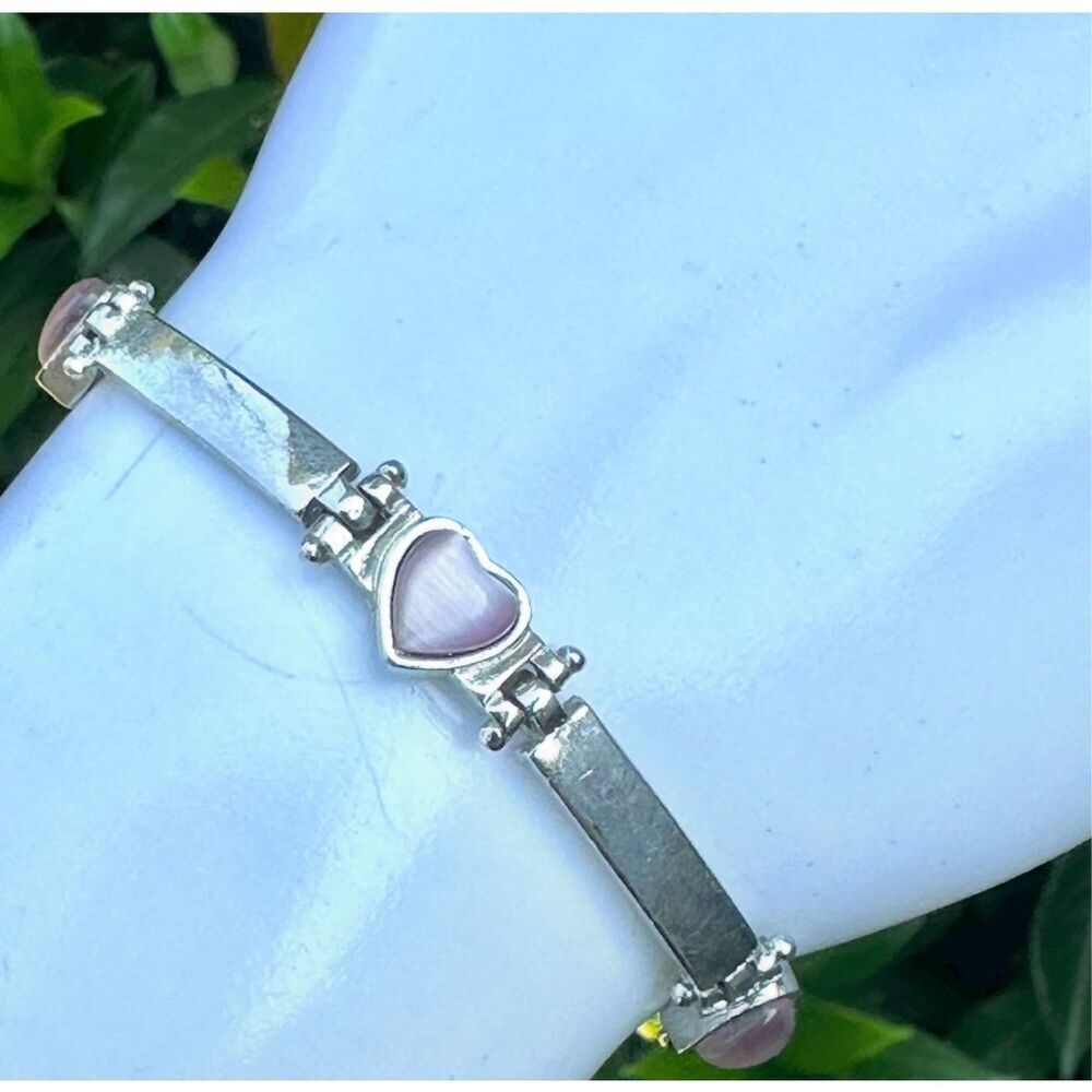 And Lovely pink cats eye silver tone heart bracelet